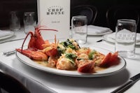 a plate of lobster and seafood on a table
